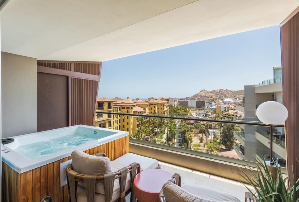 Toast the city lights from your bubbling terrace retreat.