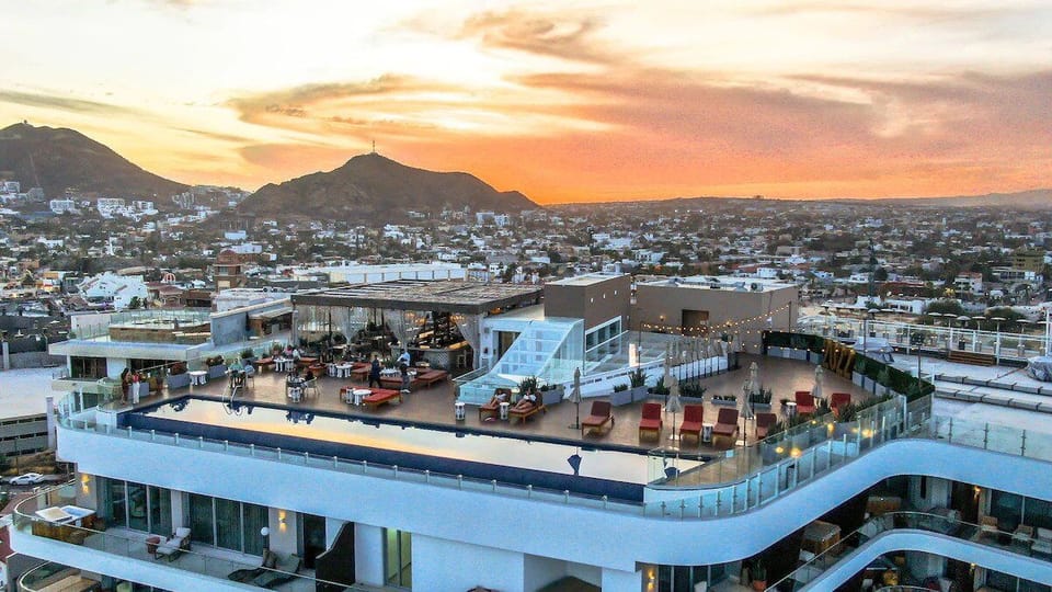 Unwind at sunset on the rooftop pool above Cabo.