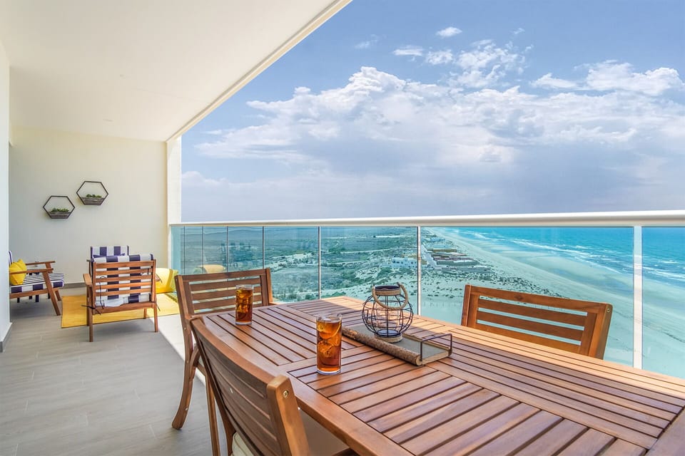 the beach stretched to the horizon from your patio
