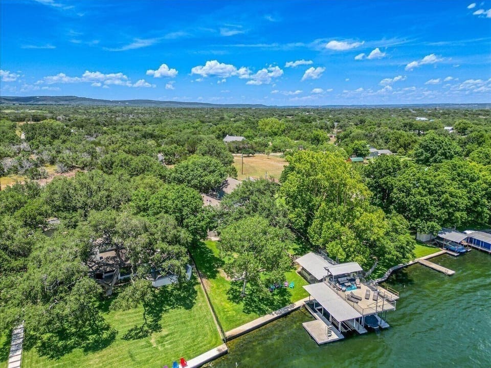 Aerial view of home and lake