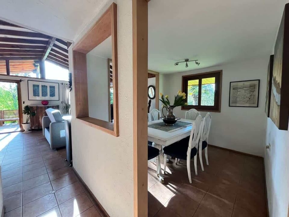 Open-plan dining & kitchen area w/ seamless flow between spaces