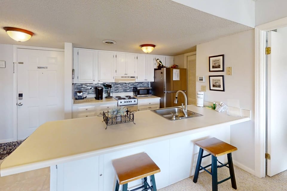 The galley kitchen is equipped with everything needed to prepare meals! Including a Keurig coffee maker!