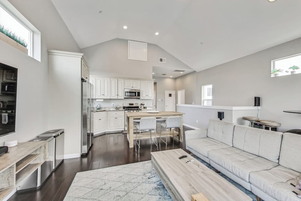 Open concept living room, dining room, and kitchen