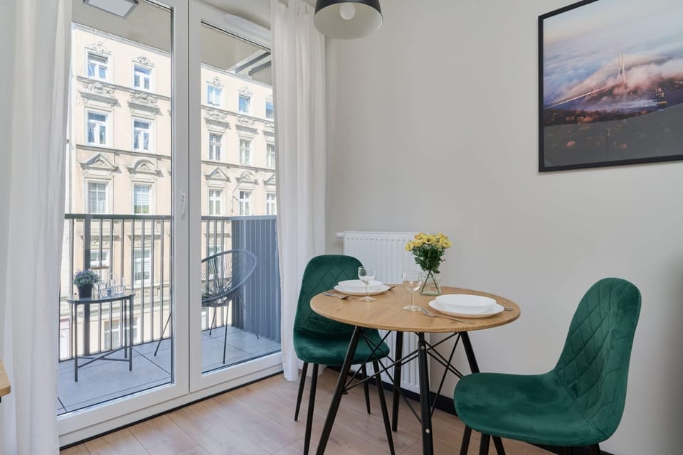 Dining area and access to balcony.