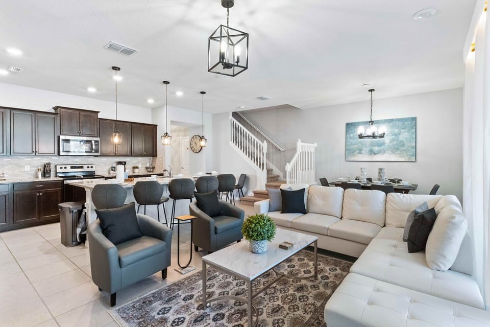 The living area is designed for modern relaxation, featuring a sleek smart TV. A space where technology meets comfort, creating the perfect setting for cinematic experiences and cozy evenings at home.