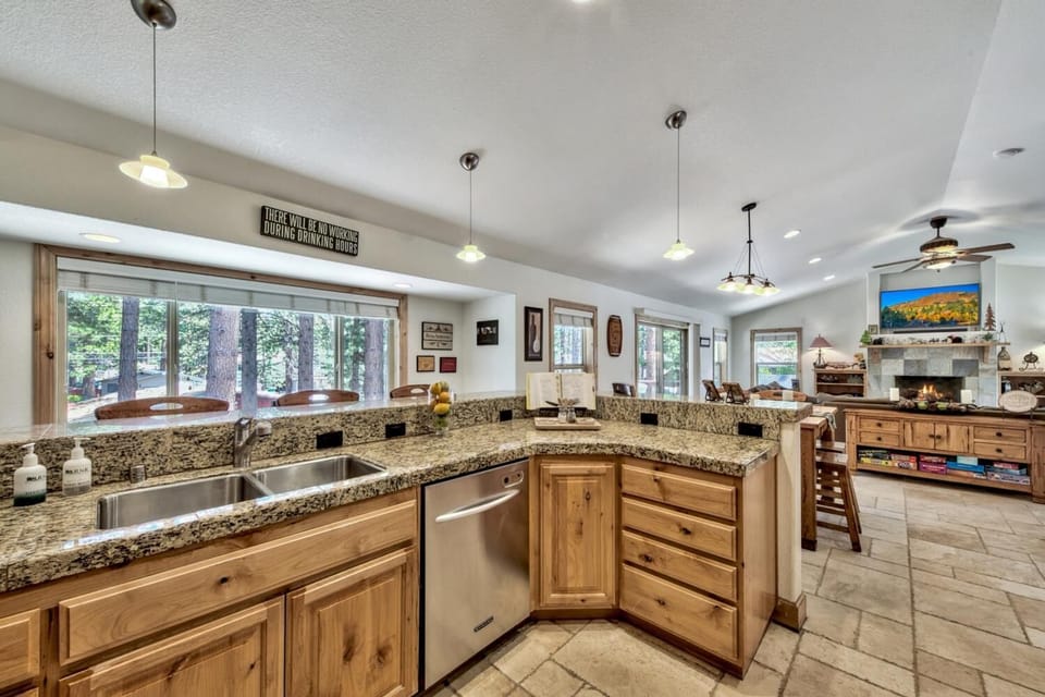 The whole family can gather around while the chef puts on a show! The kitchen opens up to the living area, with a large family dining table (seats 8) joining the two.