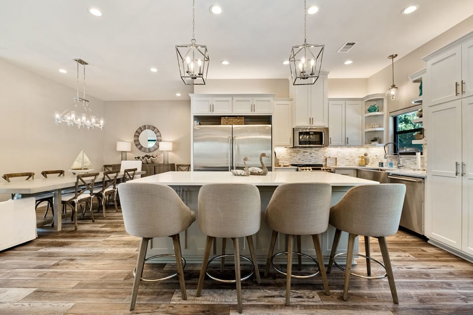 Kitchen & dining area can accommodate 18 guests, open to living and game rooms.