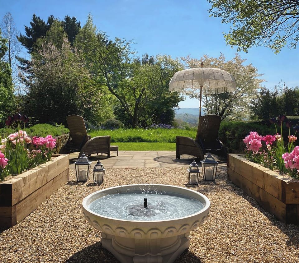 Garden water feature, two sun loungers and views 
