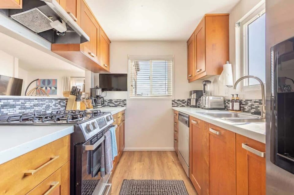 Enjoy spectacular views from this updated kitchen, with a peekaboo window that opens to the dining area

