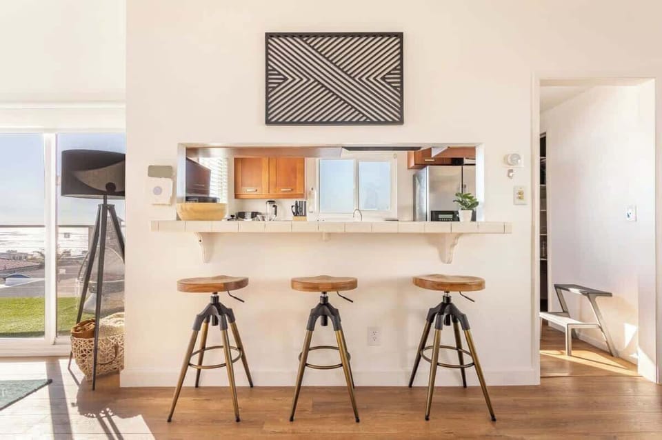 Cook up your favorite meals in a sleek, sunlit kitchen designed for comfort and ease.

