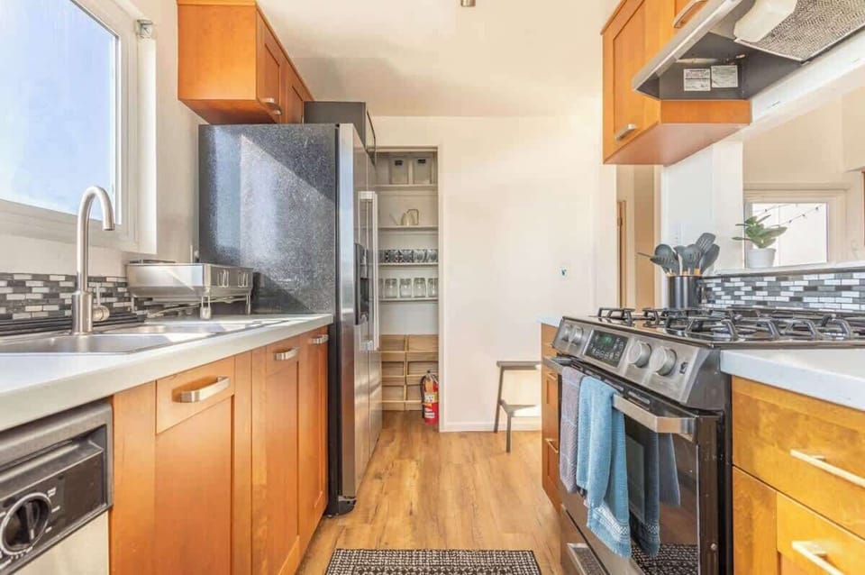 The kitchen includes a gas range, dishwasher, microwave and full size refrigerator

