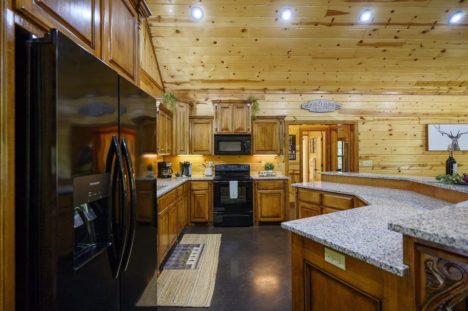 The kitchen is fully stocked with everything you would need to prepare meals.