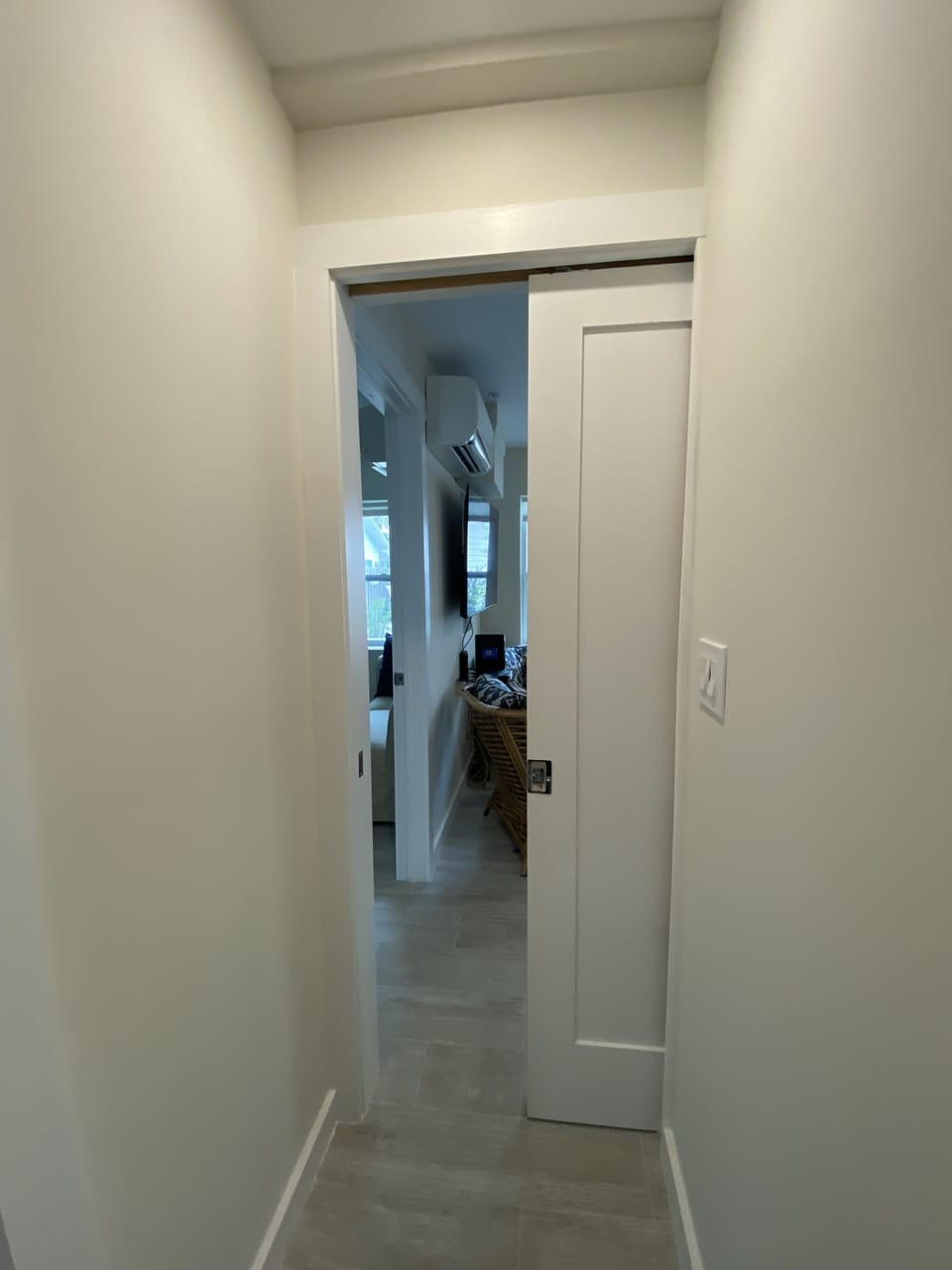 POCKET DOORS LEAD TO LIVING ROOM