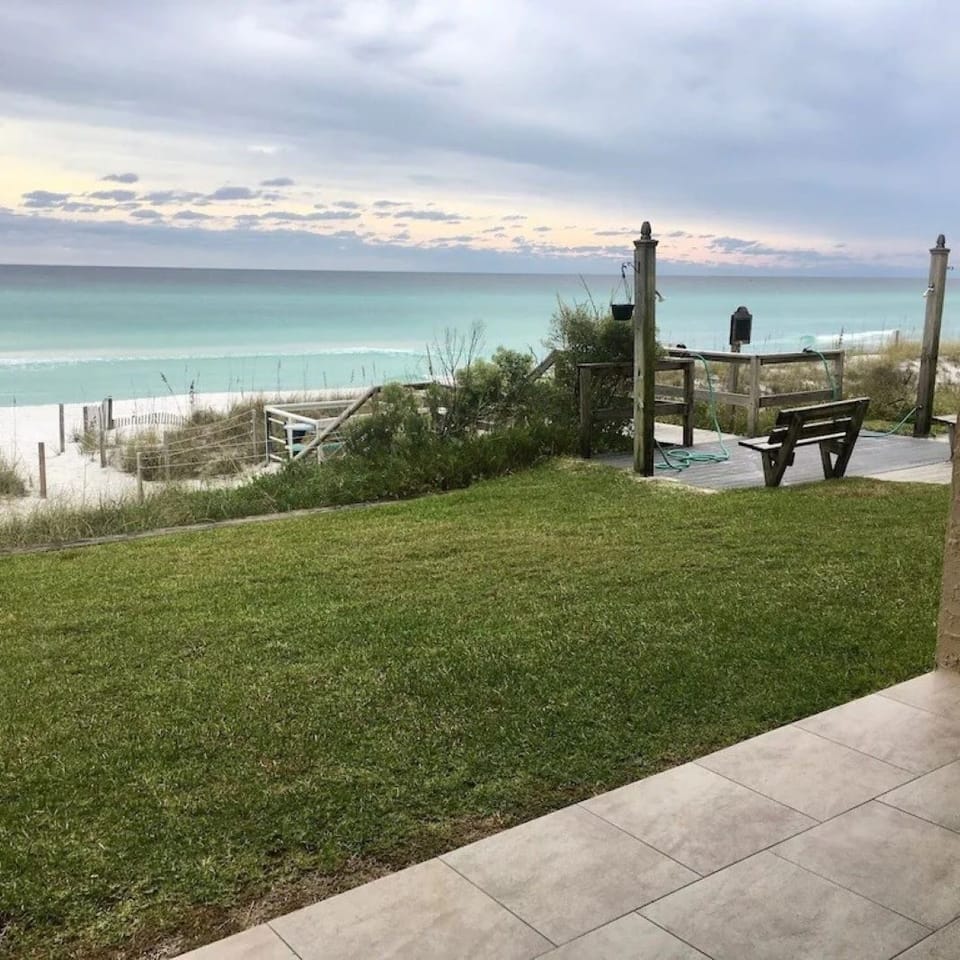 Taken from inside the unit  Looking west  Steps to the beach  walkover