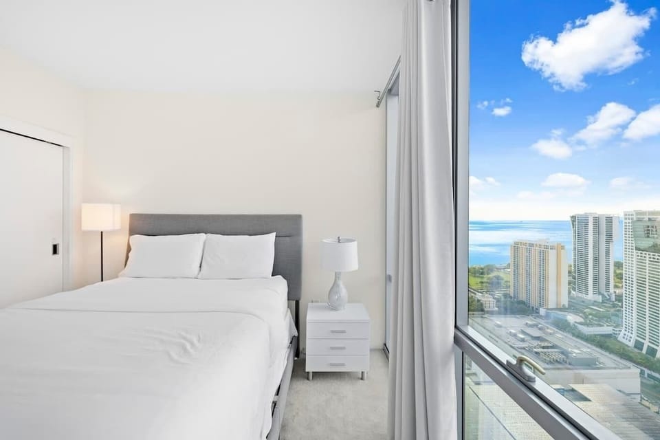 A comfy bed awaits you in this serene bedroom