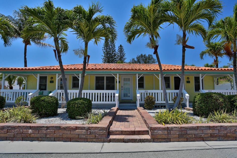 Three connected fully updated one bedroom, one bath units, with covered porch.