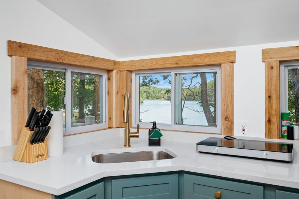 Kitchen with a View: Bright and airy space with modern appliances and stunning lake views!