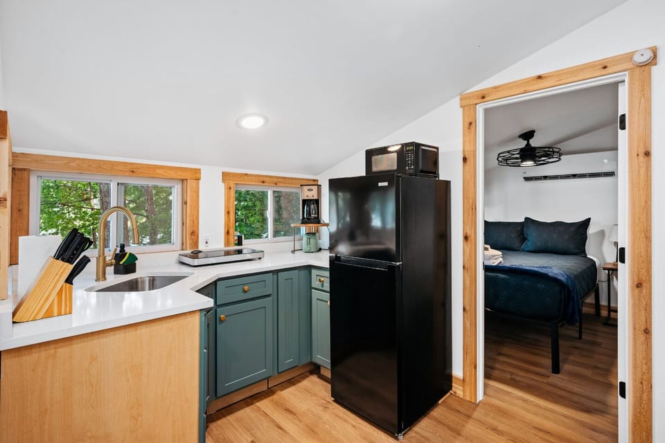 Enjoy the charm of this well-equipped kitchenette with inviting views!