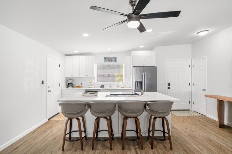 Cook, chat, and create—this kitchen is as beautiful as it is practical. Everything you need to whip up your favorite meals while on vacation.
