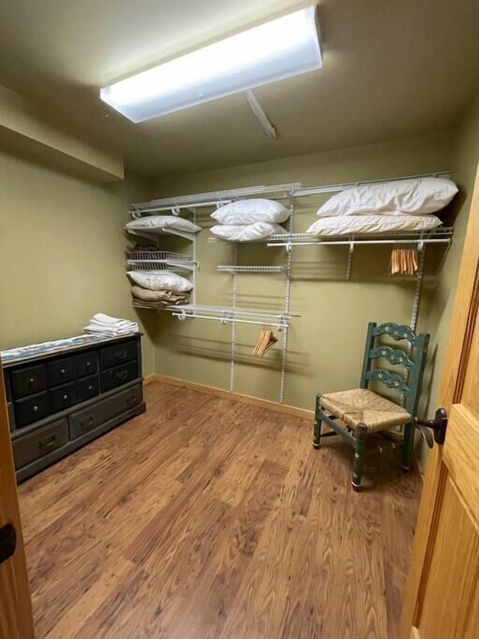 Primary bedroom walk in closet