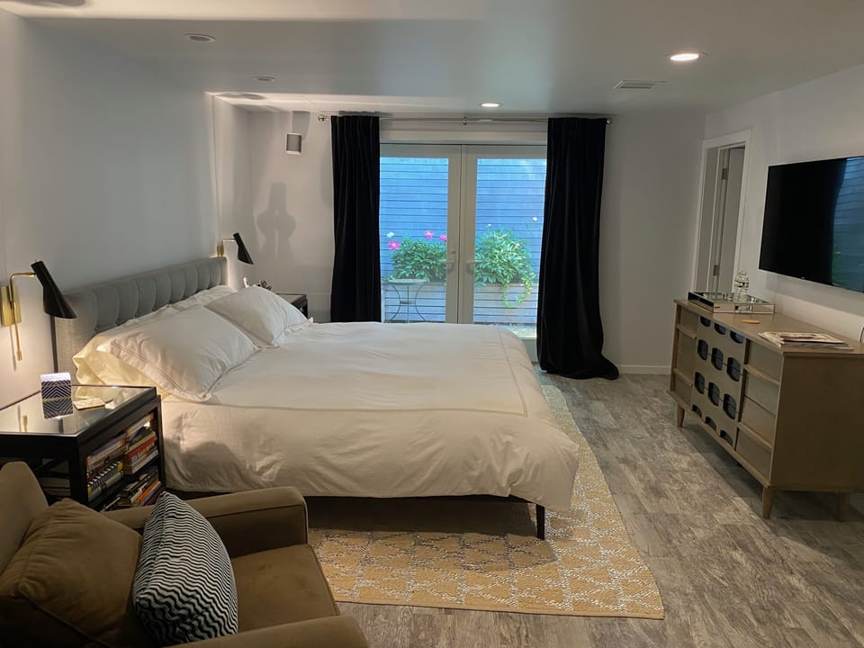 Lower Level Master Suite at Main House.  King Size bed and TV.