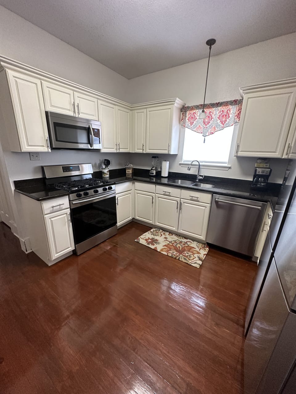 Kitchen — 5 burner gas stove with oven, quad refrigerator, microwave, dishwasher