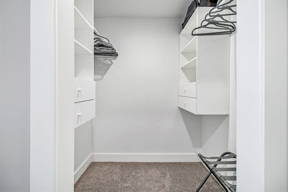 Primary suite walk in closet.