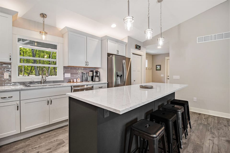 Huge kitchen island with all the amenities needed for meal preparation.