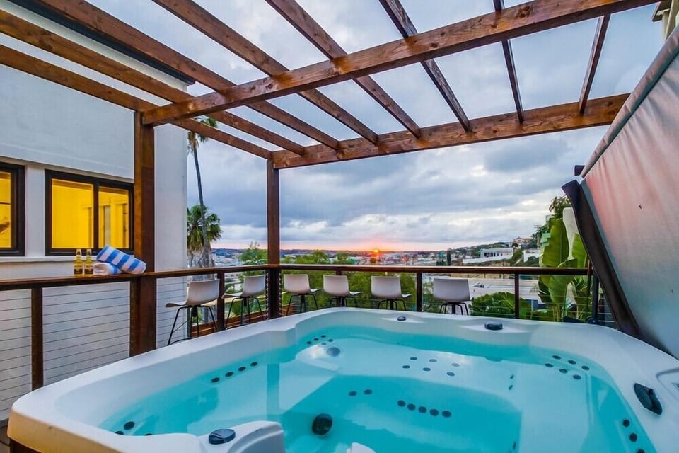 Take in the stunning views on the deck with a hot tub and outdoor seating.