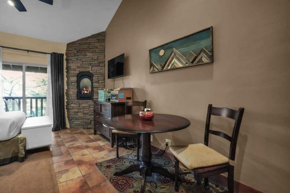 The cozy dining area has seating for 2 guests and can also double as a workspace if you need to get any tasks done.