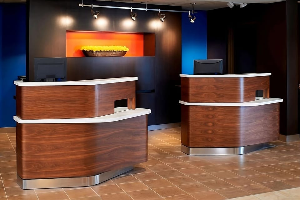 Check in quickly at a modern front desk with friendly service.