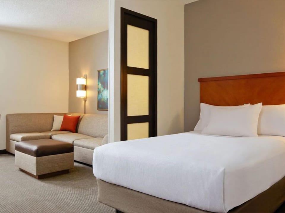 Unwind in a spacious suite with cozy lounge seating.