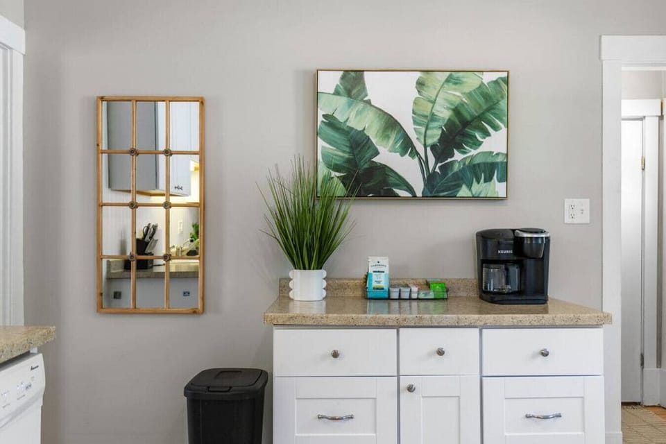 The coffee and tea bar includes all the essentials for your beverage of choice. A Keurig with a starter set of ground coffee, tea, K-cups, sweeteners, and creamer are provided!