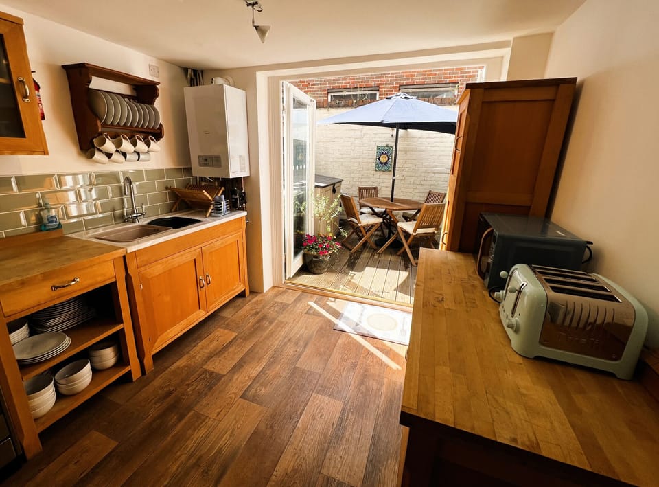 Cook and dine in the fully equipped modern kitchen at Bell Cottage, perfect for your Isle of Wight holiday.