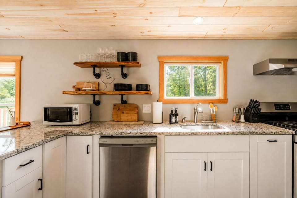 Load the dishwasher after dinner and grab glasses from the shelf for drinks. Cutting boards are out and ready if you need to prep something fresh before cooking.