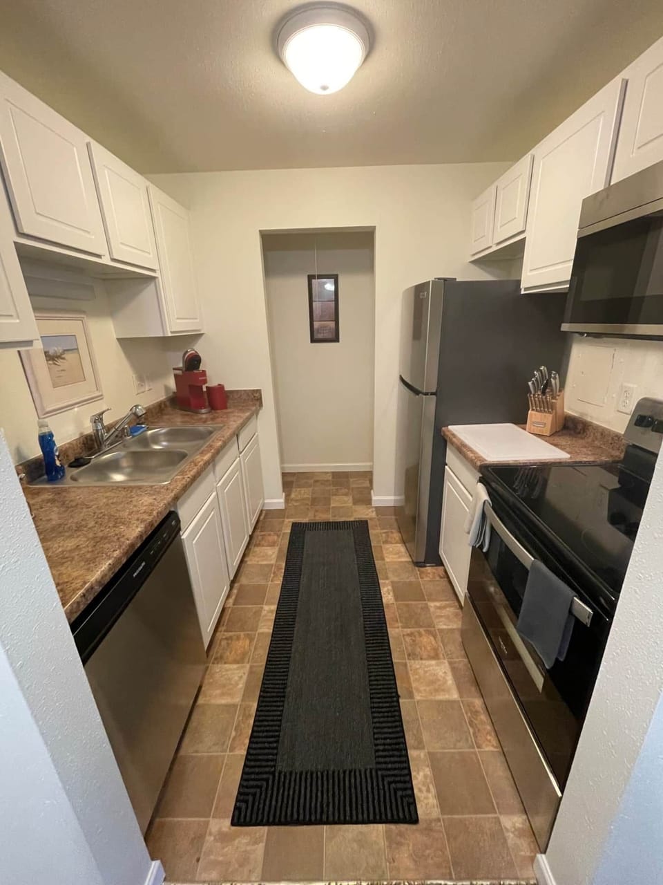 Fully Stocked Kitchen with Stainless Steel Appliances