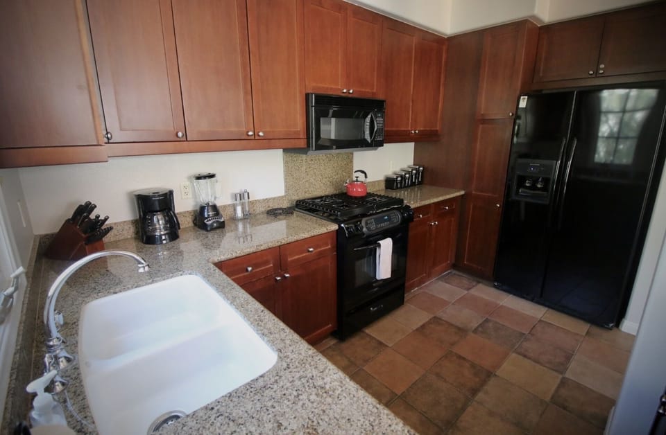 KitchenAid appliances in the kitchen. Marble countertops. Fully furnished.