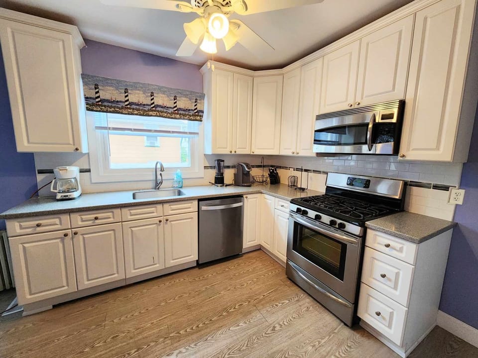 Kitchen with dishwasher, Keurig, and large refrigerator
