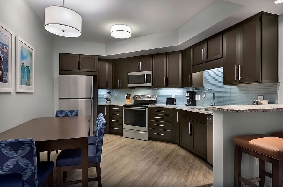 Cook and gather in a modern kitchen with comfortable dining.