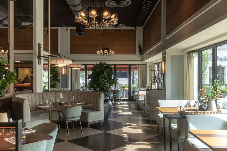 Gather for a stylish meal in a sunlit, design-forward restaurant.