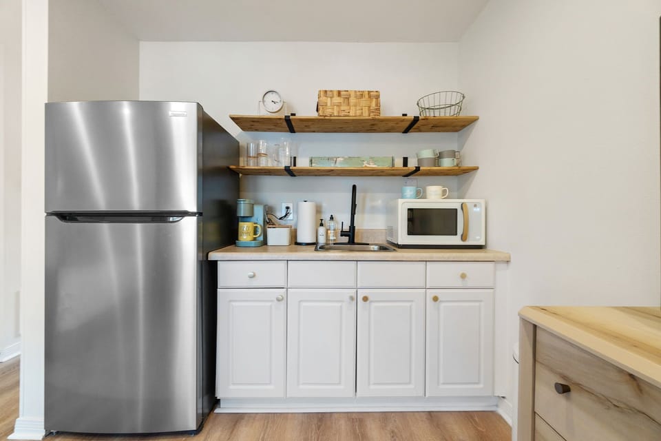 Kitchenette with refrigerator, microwave, keurig, sink