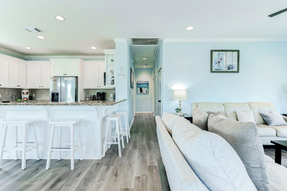 Open Design Kitchen and Living Room: Breezy and bright, with sleek decor—perfect for relaxing after beach adventures!