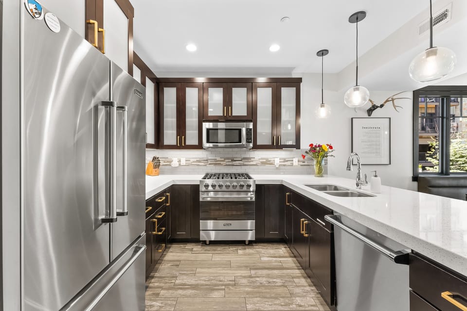 - Cook in a sleek kitchen with stainless steel appliances and gas range  
- Bright countertops and modern cabinets give a polished clean style  
- Prepare meals easily with spacious layout and ample storage options