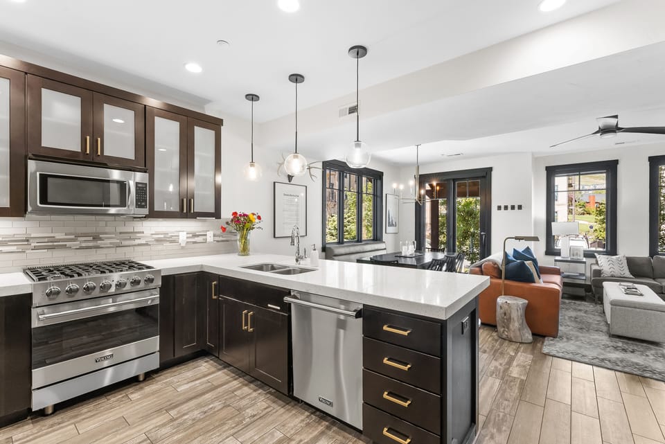 - Prepare meals in a chef-ready kitchen with stainless appliances  
- Modern backsplash and cabinetry give the space a sleek look  
- Bright countertops and open layout make cooking enjoyable