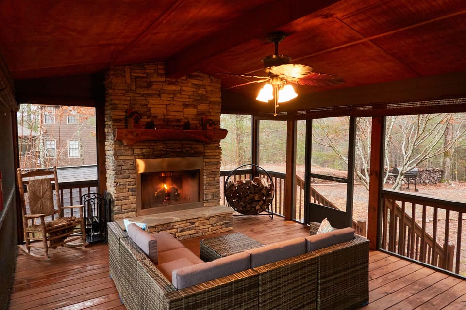 Fully screened in Outdoor side patio with wood burning Fireplace (non propane)
