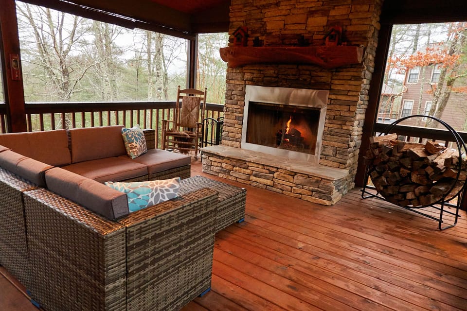 Fully screened in Outdoor side patio with wood burning Fireplace (non propane)