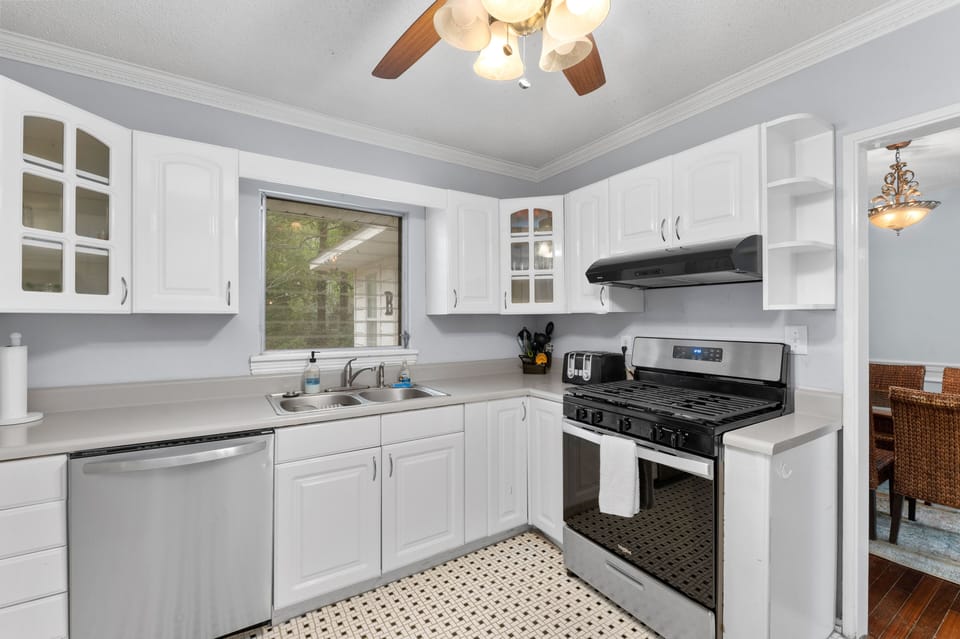 New stainless appliances and overlooks the back deck and HUGE back yard 