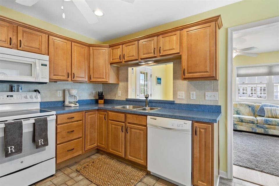 Warm Wood Cabinetry and Beachy Blue Countertops.