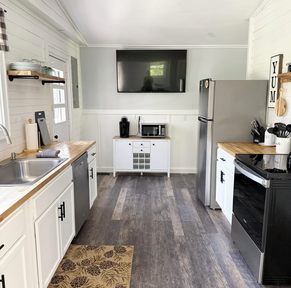 The dazzling galley kitchen welcomes any cook.