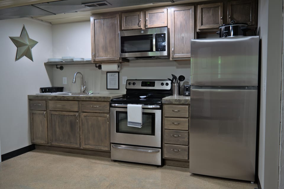 Kitchen comes with all the dishes and appliances.